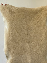 Fluffy offwhite sheep skin