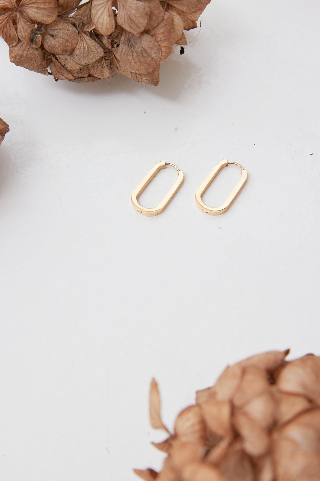 oval long thick gold earrings