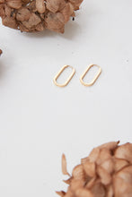 oval long thick gold earrings