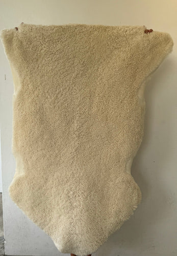 Fluffy offwhite sheep skin