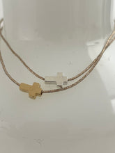 Thick cross bracelet on lurex string
