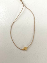 Thick cross bracelet on lurex string