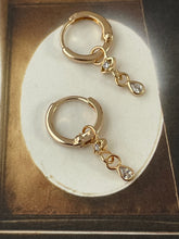 Hoop earrings with eye and stone plated gold