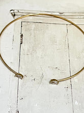 Thin bangle with joining diamond shaped stones