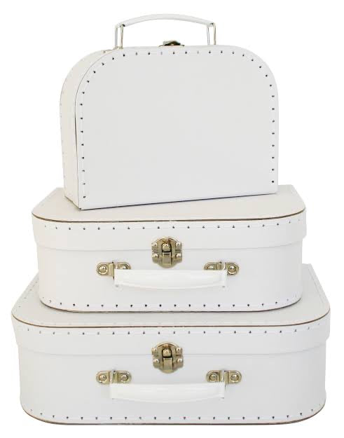 Set of three white suitcases