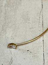 Thin bangle with joining diamond shaped stones
