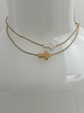 Thick cross bracelet on lurex string